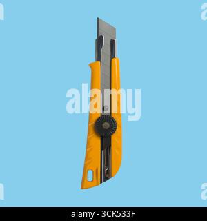 A yellow utility knife with a retractable blade, designed for cutting various materials safely and efficiently. Stock Photo