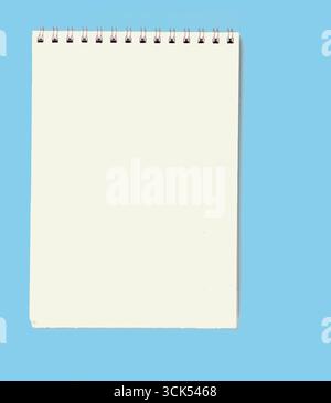 A blank spiral notebook ready for notes or sketches. Stock Photo