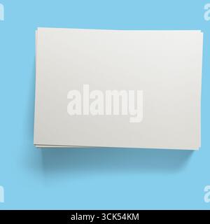A blank sheet of paper stacked neatly, suggesting potential for writing or drawing. Stock Photo