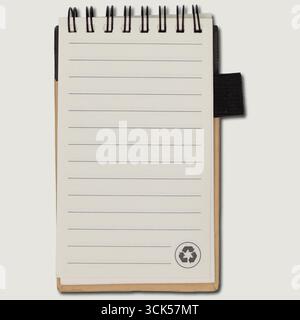 A small spiral-bound notebook with blank lined pages, ideal for jotting down notes or ideas. Stock Photo
