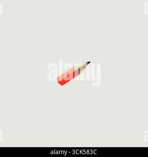 A simple red pencil with a sharpened tip, often used for writing or drawing. Stock Photo