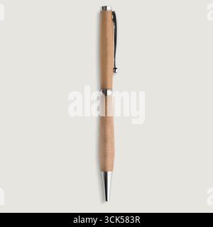 A sleek wooden pen with a silver clip and tip, designed for writing and office use. Stock Photo