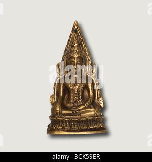 A small golden statue of Buddha, symbolizing peace and spirituality. Stock Photo