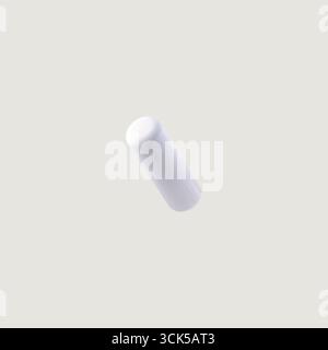 A simple white cylindrical object, possibly a container or a capsule, presented in a minimalist style. Stock Photo