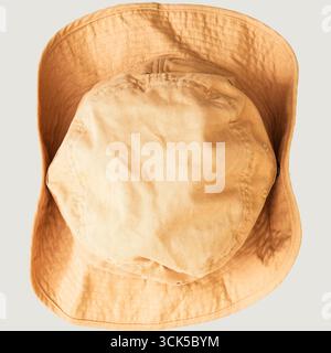 A beige bucket hat viewed from above, typically used for sun protection and outdoor activities. Stock Photo