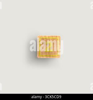 A wooden block displaying the number 2, often used for educational purposes in early childhood learning. Stock Photo
