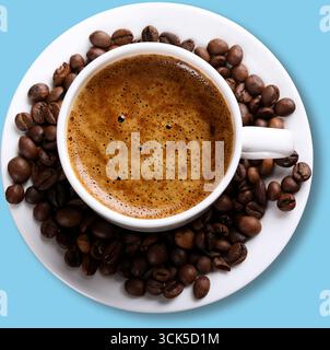 A cup of coffee surrounded by coffee beans, showcasing a rich brew and inviting aroma. Stock Photo