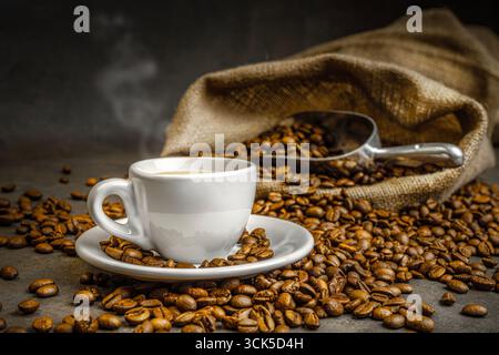 coffee steaming white cup roasted beans Stock Photo