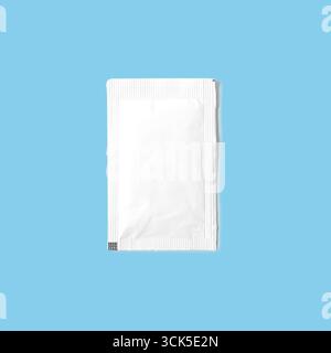 A plain white packet, likely containing a single-use product or sample. Stock Photo