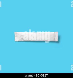 A plain white sealed packet, possibly containing a powdered substance or condiment. Stock Photo
