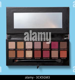 A makeup palette featuring a variety of eyeshadow colors for creating different looks. Stock Photo