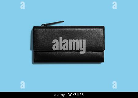 A sleek black leather wallet with a minimalist design, ideal for holding cash, cards, and small items securely. Stock Photo