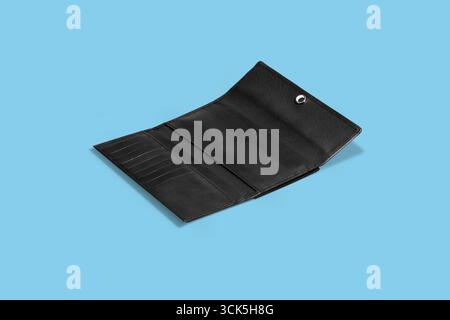 A black leather wallet opened to display compartments for cards and cash. Stock Photo