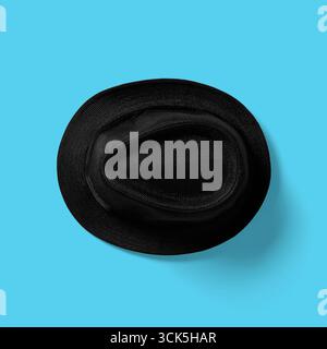 A black hat viewed from above, showcasing its round shape and textured fabric. Stock Photo