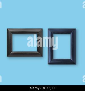 Two empty picture frames in black and dark blue, designed for displaying artwork or photographs. Stock Photo