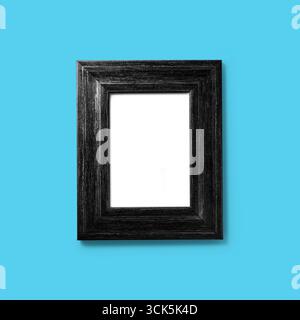 A simple black wooden picture frame with a blank interior space, ready for a photo or artwork. Stock Photo