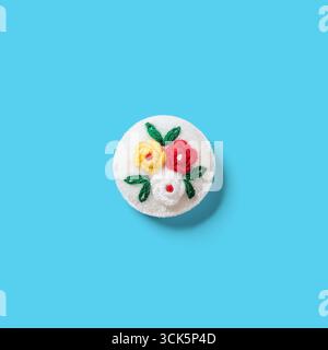 A round, white embroidered patch featuring colorful flowers in red, yellow, and green. Ideal for decoration or crafting projects. Stock Photo