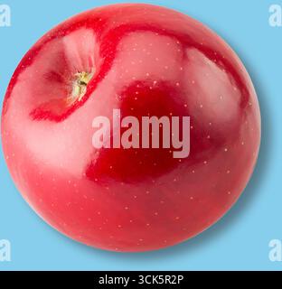 A shiny red apple, showcasing its smooth surface and vibrant color, ideal for healthy eating or as a decorative element. Stock Photo