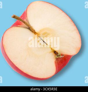 A sliced red apple showcasing its interior, highlighting its texture and color. Stock Photo