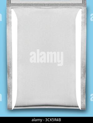 A plain silver foil packet, often used for packaging food or other products. Stock Photo