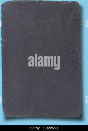 A flat, rectangular slate stone with a smooth surface, often used for serving food or as a decorative item. Stock Photo