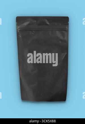 A plain black resealable pouch designed for packaging various products. Stock Photo