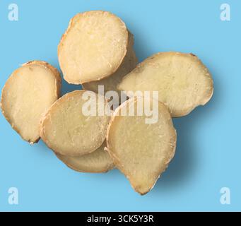 Slices of ginger root displayed on a surface, showcasing its texture and color. Stock Photo