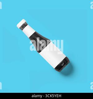 A glass bottle with a blank label, ideal for various beverages or sauces. Stock Photo