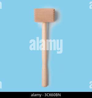 A wooden meat mallet used for tenderizing meat. Stock Photo