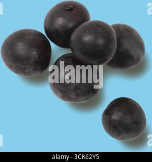 Closeup of ripe red plums arranged in a wooden bowl on a rustic wooden ...