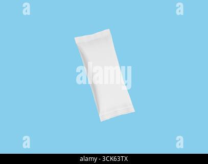 A plain, white packaging pouch, typically used for single-serve products or samples. Stock Photo