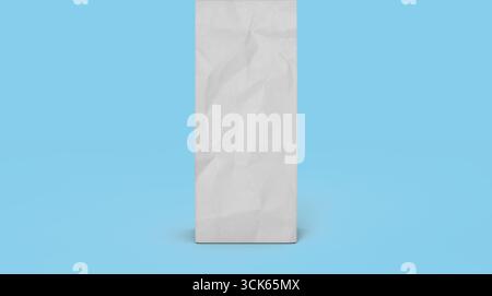A crumpled blank paper bag standing upright, suggesting potential for branding or design. Stock Photo