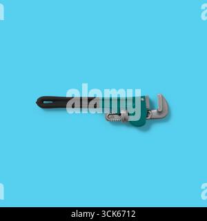 A large adjustable wrench designed for gripping and turning pipes and fittings. Stock Photo