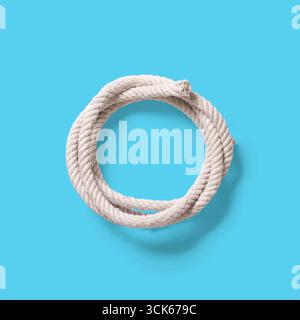 A coiled piece of rope, often used for tying, securing, or climbing purposes. Stock Photo