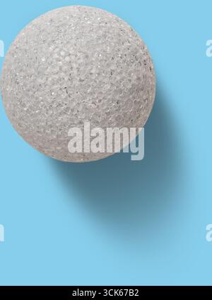 A textured, spherical object with a glittery surface, resembling a decorative or crafting item. Stock Photo