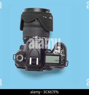 A digital camera with a zoom lens, designed for photography enthusiasts and professionals. Stock Photo