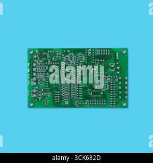 A printed circuit board (PCB) showcasing intricate electronic pathways and components for circuit assembly and functionality. Stock Photo