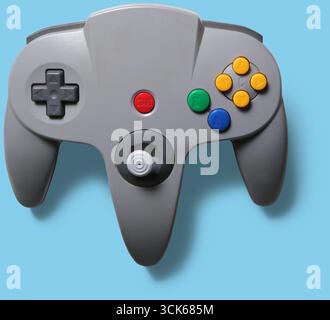 A classic video game controller with buttons and a joystick for gaming. Stock Photo