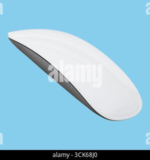 A sleek, modern wireless computer mouse designed for ergonomic use and efficiency. Stock Photo