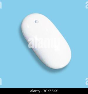 A sleek, white computer mouse designed for ergonomic use and efficient navigation. Stock Photo