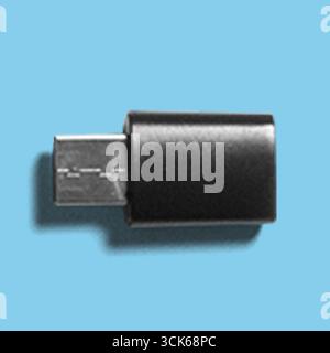 A black USB flash drive designed for data storage and transfer. Stock Photo