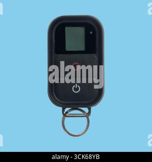 A compact remote control device featuring a small display and buttons for operation. Stock Photo
