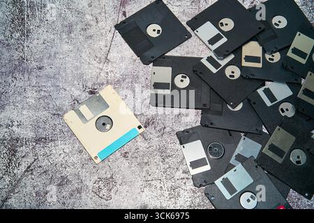 Overhead view of old black and white floppy disks placed on surface in studio Stock Photo