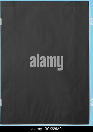 A plain black paper background, suitable for various graphic design purposes. Stock Photo