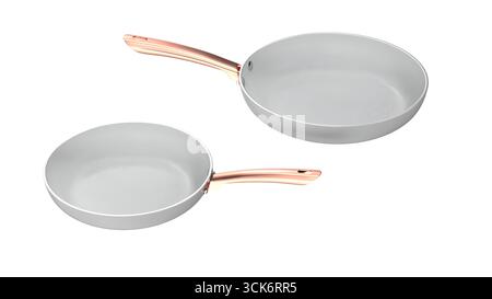 Two non-stick frying pans with sleek design and rose gold handles, ideal for cooking various dishes. Stock Photo