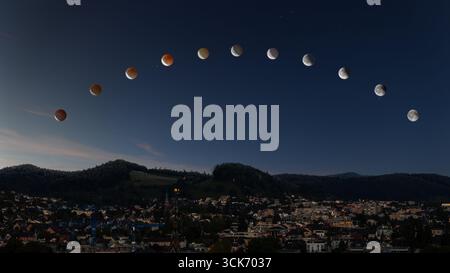 Composite of lunar eclipse sequence on September 07. 2025 over the Swiss city Baden. Stock Photo