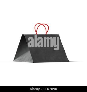 A black paper bag with red handles, designed for shopping or carrying items. Stock Photo