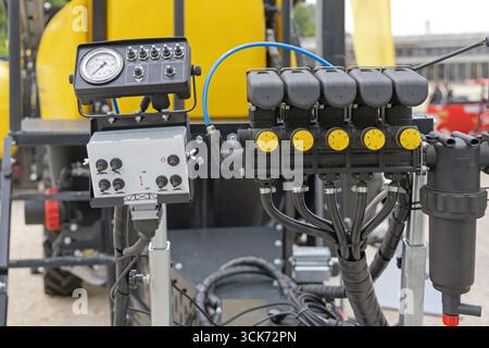 Pressure Gauge On Off Switch Board Control Panel Valve Knobs at Agricultural Sprayer Machine Stock Photo
