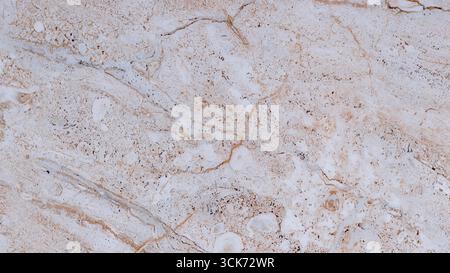 A close-up view of a textured surface resembling marble, showcasing natural patterns and colors. Stock Photo