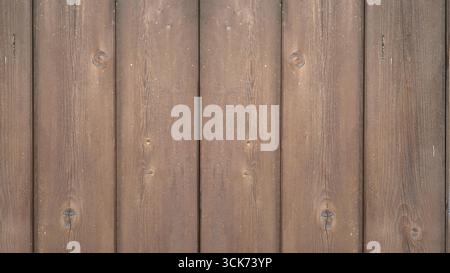 A wooden interior scene featuring a textured wall and floor, creating a cozy and rustic atmosphere. Stock Photo
